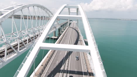 high angle view of a modern arch bridge across a body of water