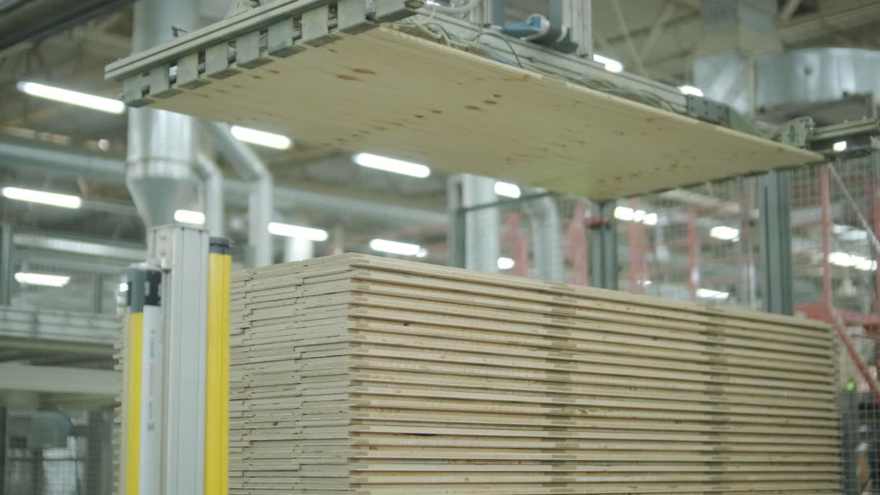 Automated Machine Stacking Wooden Boards in a Factory