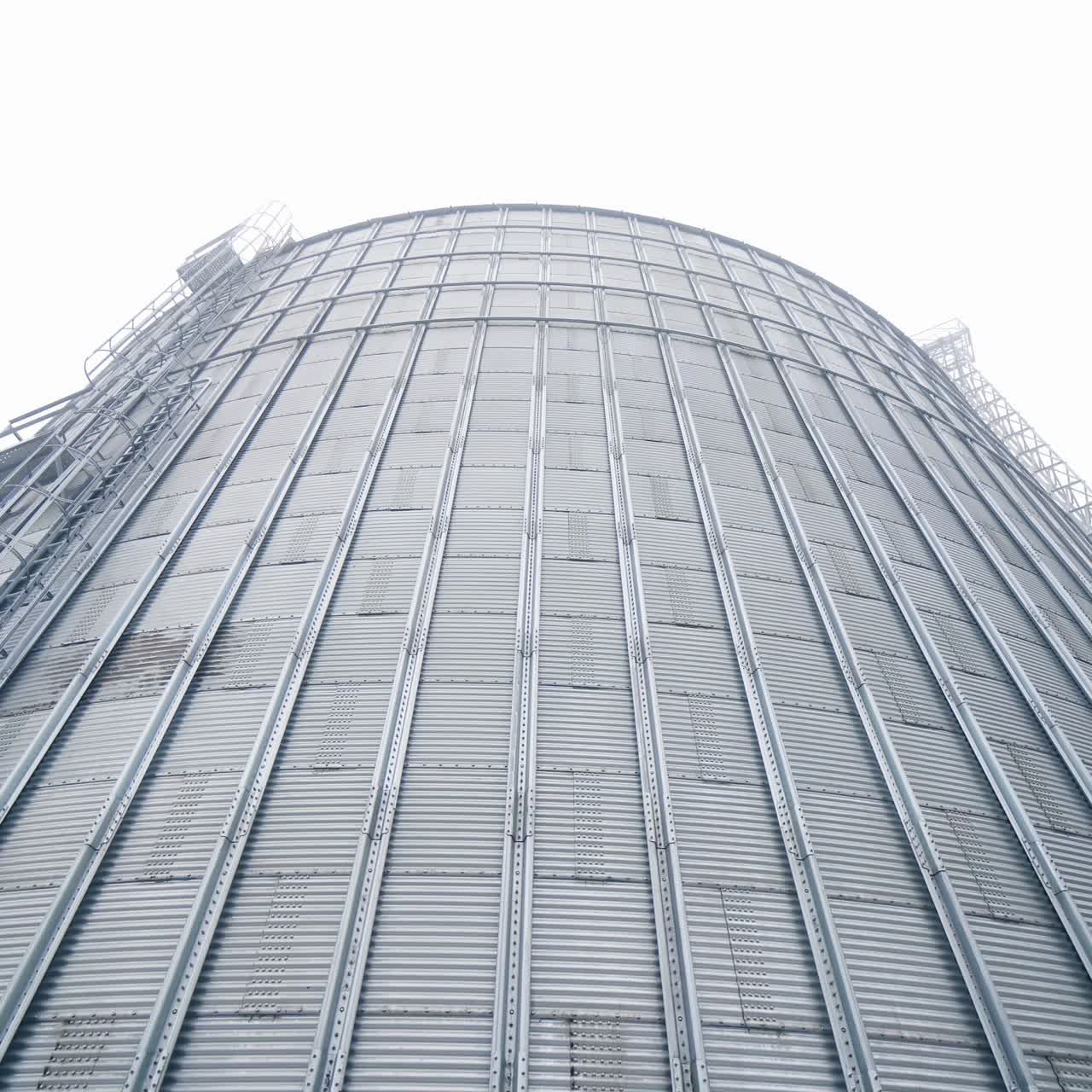 Huge steel elevator storage. Food industry agricultural tank