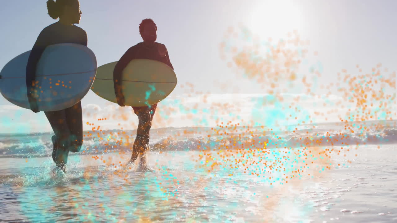 Two surfers carrying surfboards running into water on beach, with technology graphs and wave icons