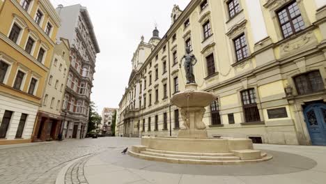 4k cinematic of wroclaw university building and the swordsman fountain early morning with no people
