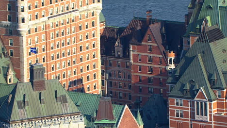 quebec flag on frontenac hotel castle, helicopter aerial view