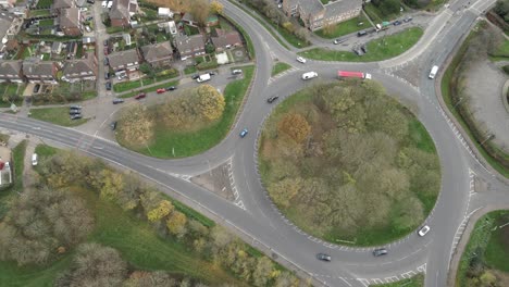 drone overhead footage of roundabout in uk with vehicles