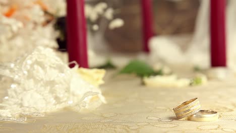 wedding rings with candles and flowers 7