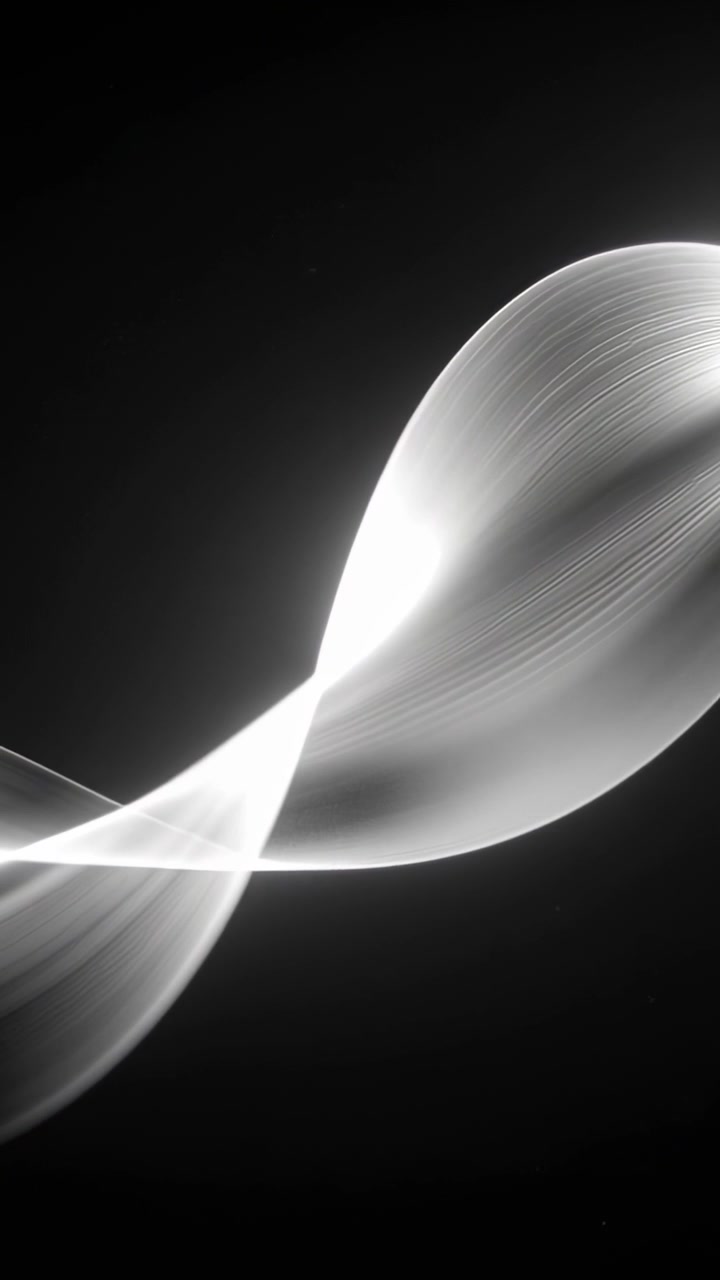Vertical video: Entering from lower-left, light ribbon twisting in dark studio, with striations