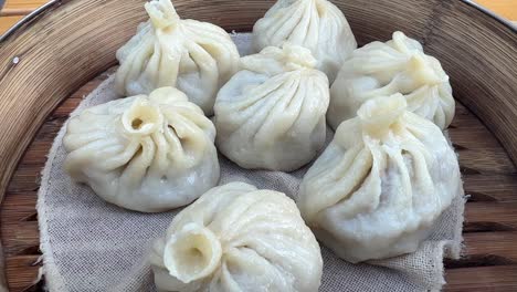 hot meat dumplings close up in bamboo steamer