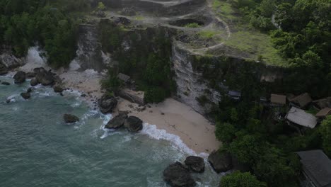 a sunny morning on a hidden beach in uluwatu, bali, indonesia