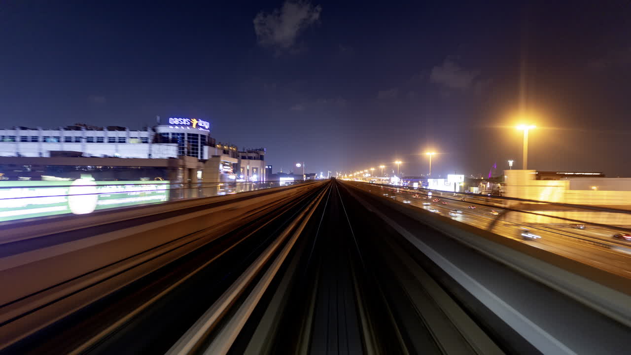 POV of Metro Train Moving Through City at Night