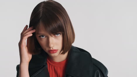 shy and sad woman with red lips in studio