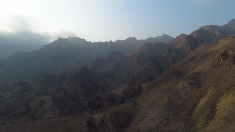 aerial - epic panning shot of a mountain in hatta