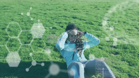 Chemical-structures-against-african-american-woman-performing-crunches-exercise-in-the-garden