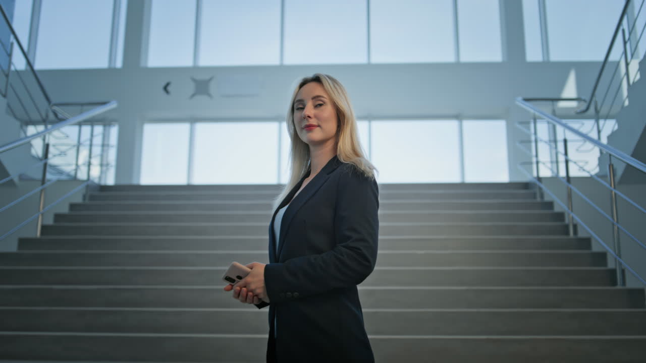 Confident businesswoman standing office staircase closeup. Woman executive