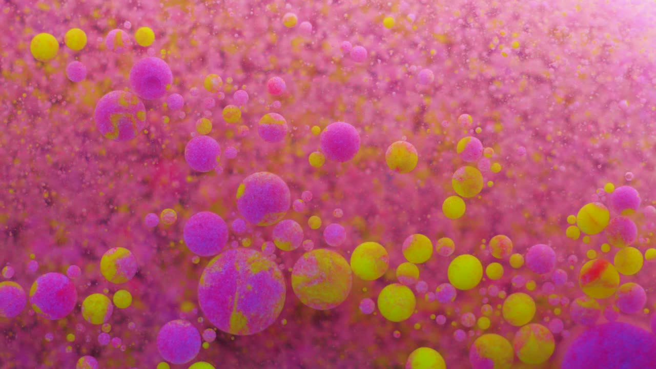 movimiento lento burbujas de color neón brillante aceite pintura fluorescente hermosa color brillante movimiento multicolor de cerca. pintura de neón acrílico. superficie fantástica. abstracto transformación de colores gravitación.