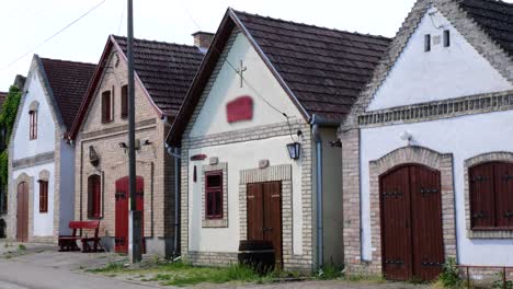 wine village hajos in hungary, presenting a cluster of houses and one decorated with a cross