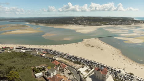 Panoramic-View-Of-Foz-Do-Arelho-Beach-And-Foz-Do-Arelho-And-Obidos-Mouth-Lagoon-In-Portugal-On-A-Sunny-Day---Aerial-Drone-Shot