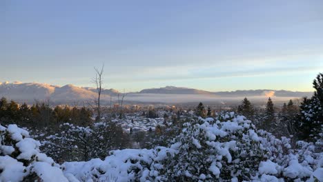 beautiful winter landscape with fog in background during sunset