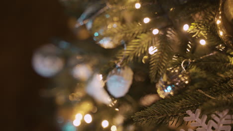 close up view of a christmas tree with christmas decorations hanging 1