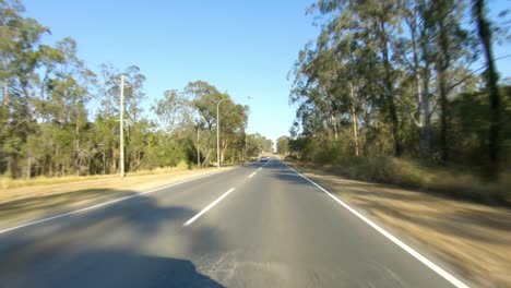 rear facing driving point of view pov of quiet australian country roads - ideal for interior car scene green screen replacement