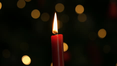 candle burning at christmas time