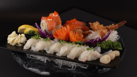 a refined mix of salmon rolls, white fish sashimi, and crispy tempura. 연어 롤, 흰살 생선 사시미, 바삭한 튀김이 어우러진 한 접시.