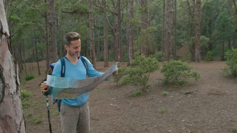 male traveler reading map