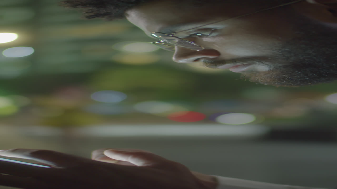 Businessman Using Smartphone Outdoors In Evening