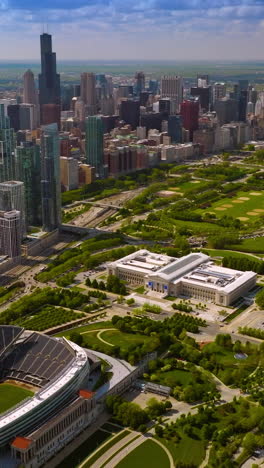fascinating panorama of chicago downtown. yacht club, soldier field stadium and green park at the backdrop of skyscrapers. vertical video