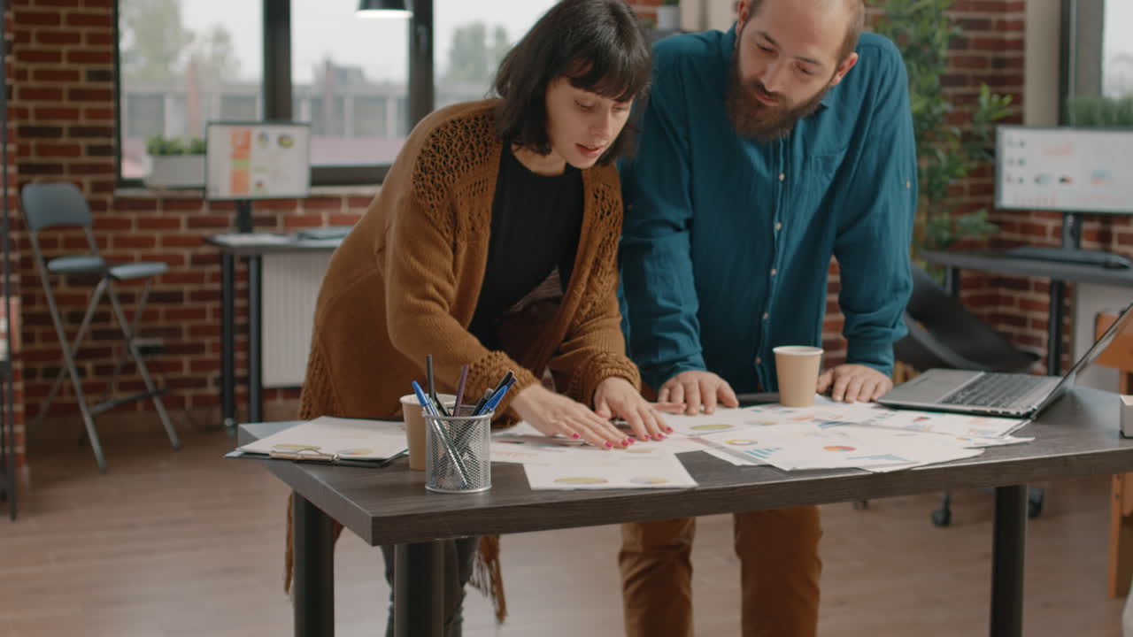 Team Collaborating on Business Charts