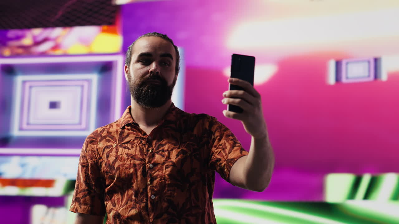 Young male performer feeling carefree with selfies and videos of himself