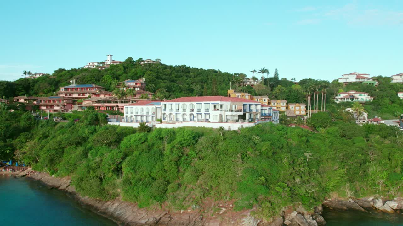 Bird's eye view of tourist villas overlooking the sea at Joao Fernandes beach, B&uacute;zios, Brazil