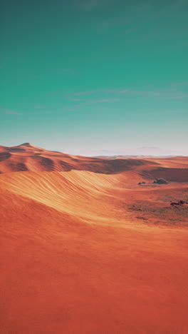 vast red sand dunes in a desert landscape