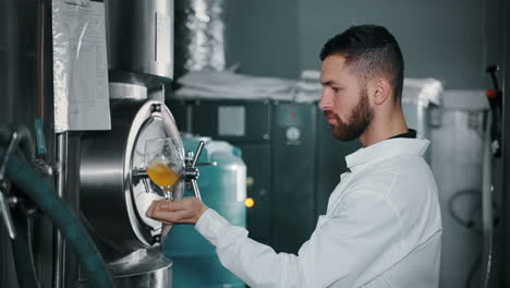 brewery worker tasting fresh beer