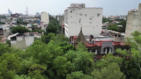 witch house behind trees, roma north cdmx