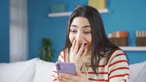 Young-woman-with-braces-reading-good-news.