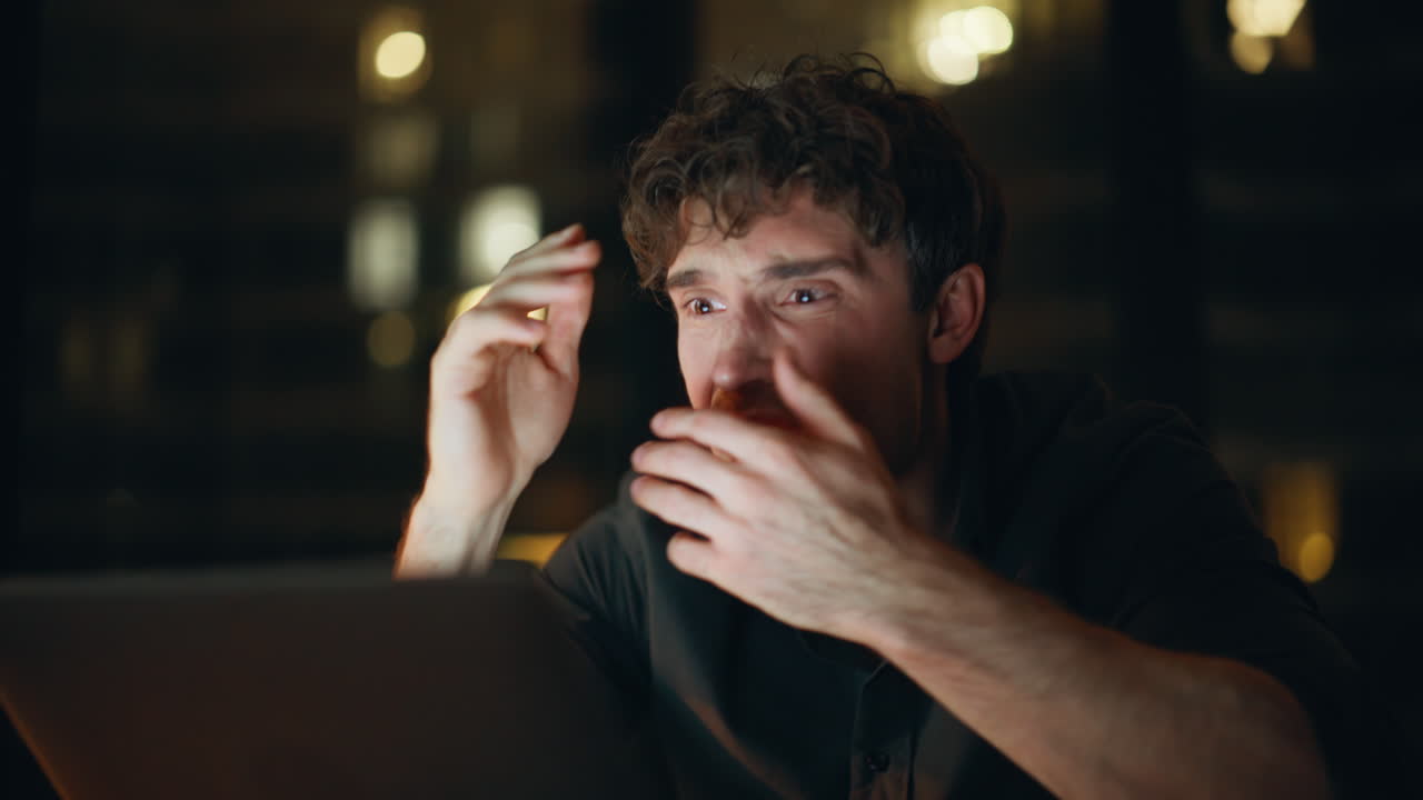 Entrepreneur shocked money loss checking balance on laptop at night closeup