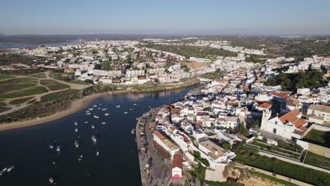 aerial view of ferragudo, a portuguese civil parish beside arade river