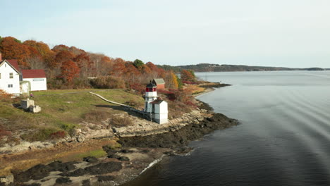 Scenic-Aerial-of-Squirrel-Point-Lighthouse-in-Phippsburg-Maine-during-a-beautiful-coastal-sunset