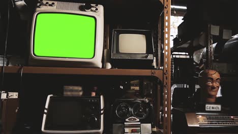 vintage portable tv set turning off green screen in an antique store interior. zoom out. 4k resolution.