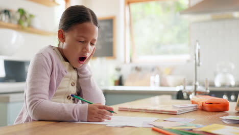 tired, yawn and child with homework in kitchen