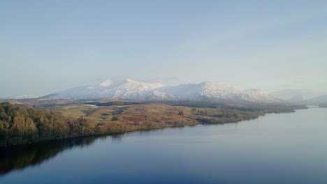 Sunrise-aerial-shot-of-a-snowy-capped-Ben-Cruachan,-a-mountain-in-Argyll-and-Bute,-Scotland