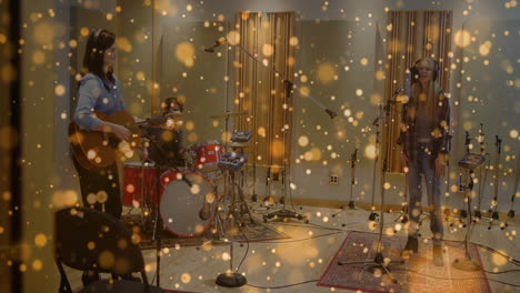 three musicians performing in recording studio, featuring floating golden bokeh and audio icons