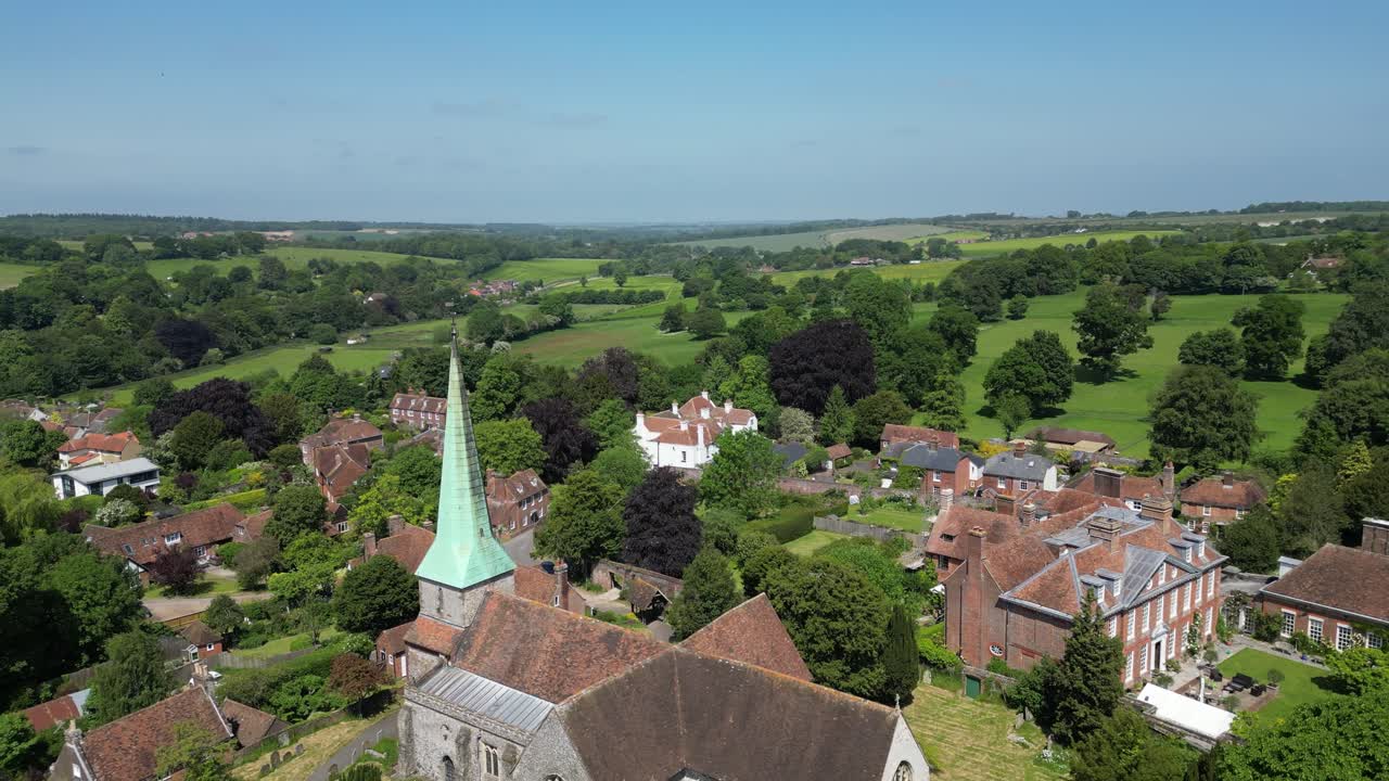 Drone backwards to reveal the village church in Barham in Kent, UK