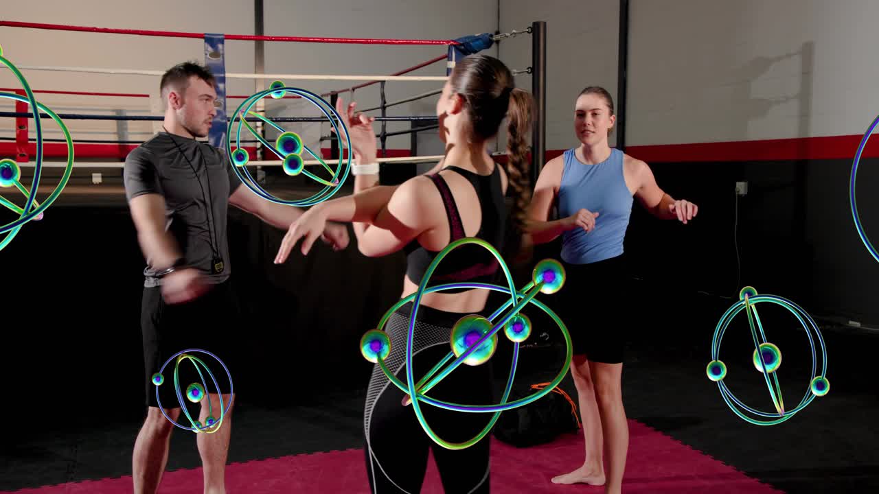 Man leading boxing warmup, group mirroring arm mobility after cue while animated orbs hiding limbs