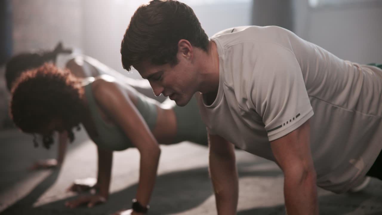 Group Doing Pushups at the Gym