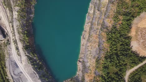 aerial view of a quarry lake with surrounding landscape