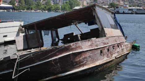 abandoned wooden boat in the water