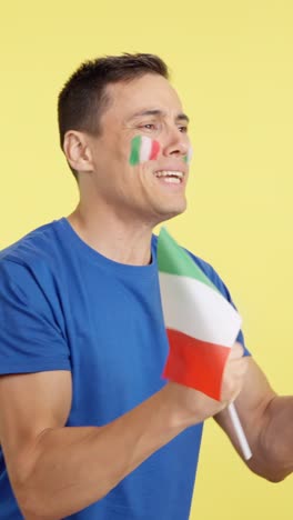 Nervous italian supporter during an exciting match looking away