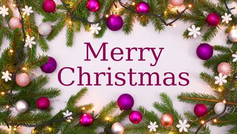 texto de feliz navidad escriba en el marco con adornos rosados, ramas de pino y luces parpadeantes.