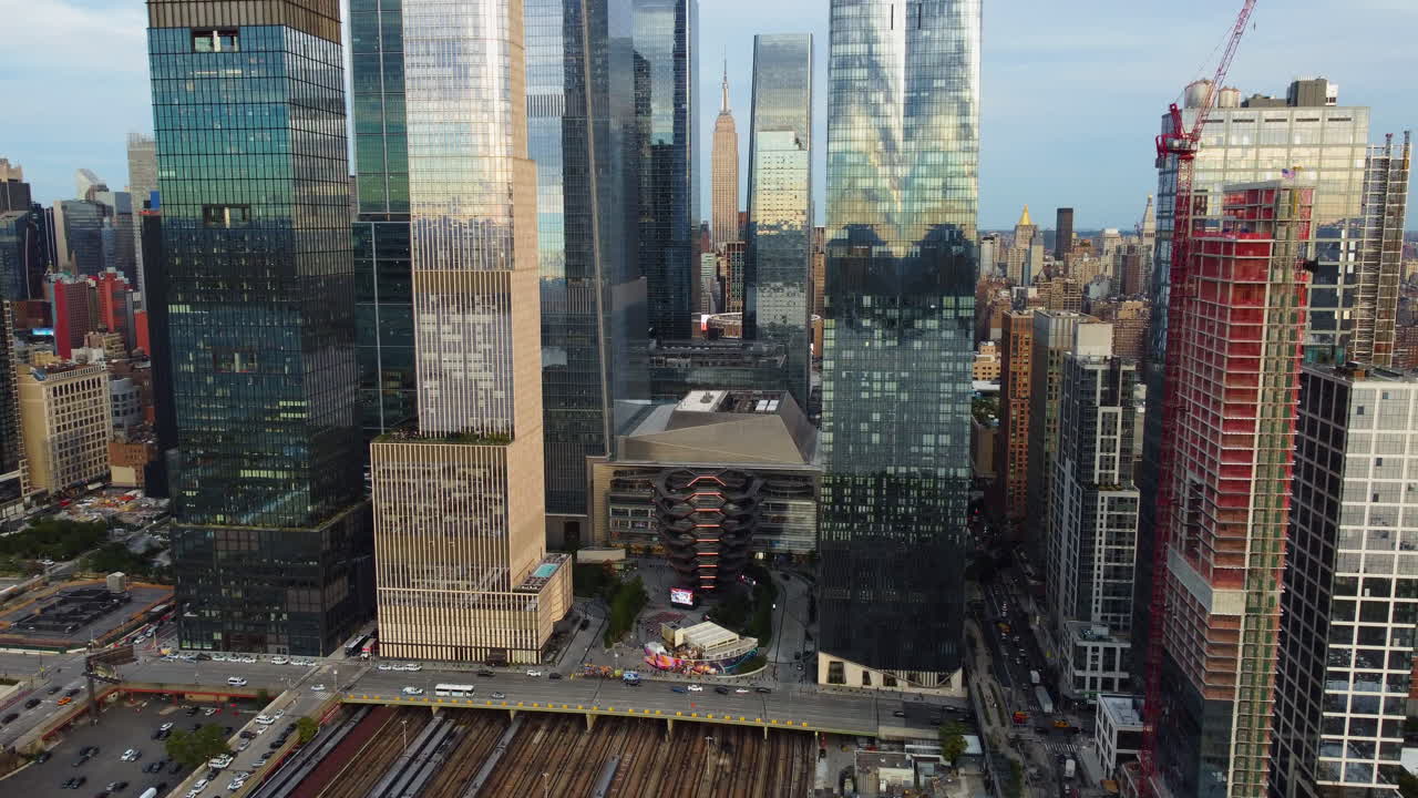 Drone rotating backwards in front of the Hudson Yards skyline, sunset in NYC