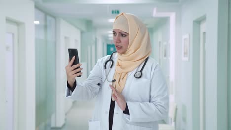 muslim doctor talking on video call